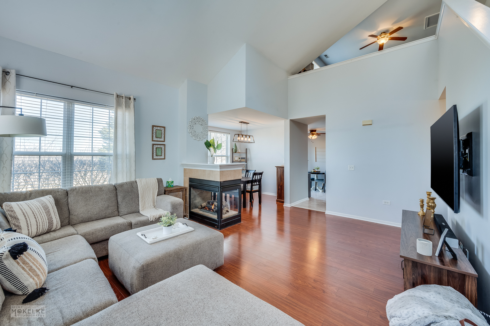 26 Rolling Oaks Road Sugar Grove, IL 60554 - Photo 6 of 25 a living room with furniture and a flat screen tv