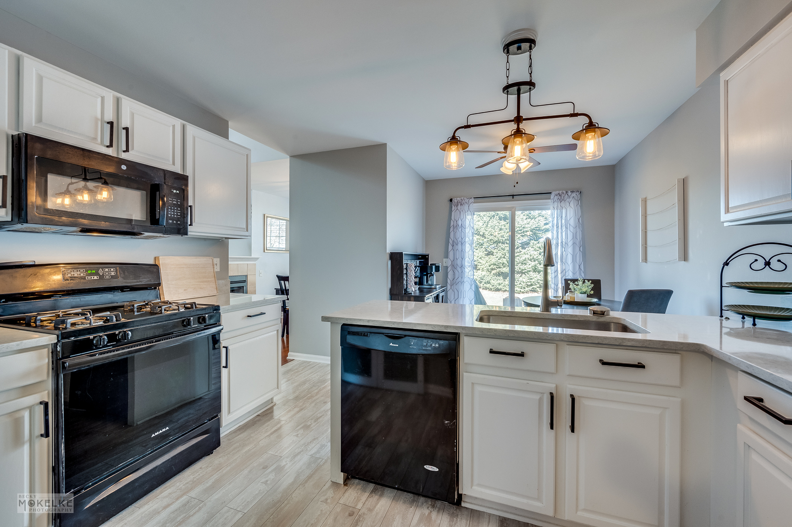 26 Rolling Oaks Road Sugar Grove, IL 60554 - Photo 8 of 25 a kitchen with stainless steel appliances granite countertop a stove a sink and a microwave