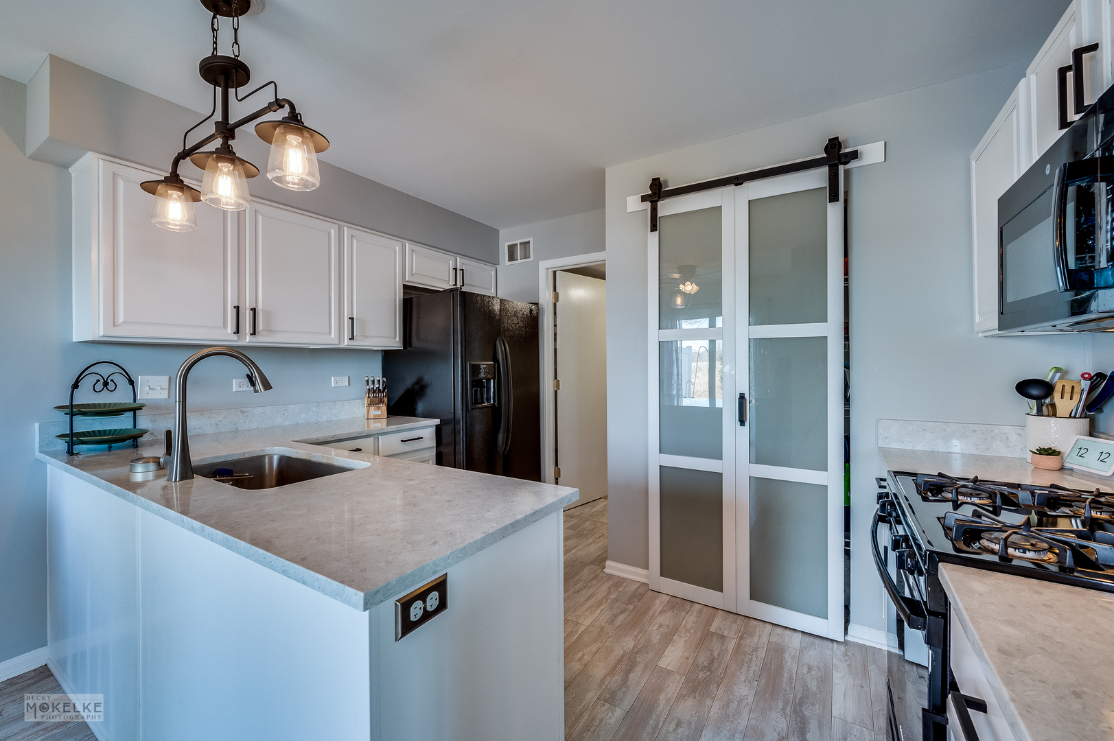26 Rolling Oaks Road Sugar Grove, IL 60554 - Photo 9 of 25 a kitchen with refrigerator cabinets and wooden floor