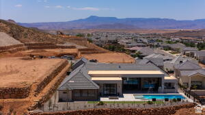 1141 East Lost Ridge Drive Washington, UT 84780 - Photo 8 of 108 Modern residence featuring a dark gray roof, stucco exterior, and an integrated swimming pool with a spa
