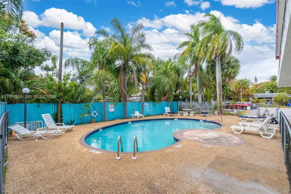 a view of a swimming pool with a lounge chairs