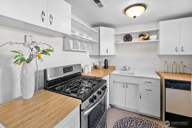 a kitchen with a stove and a sink