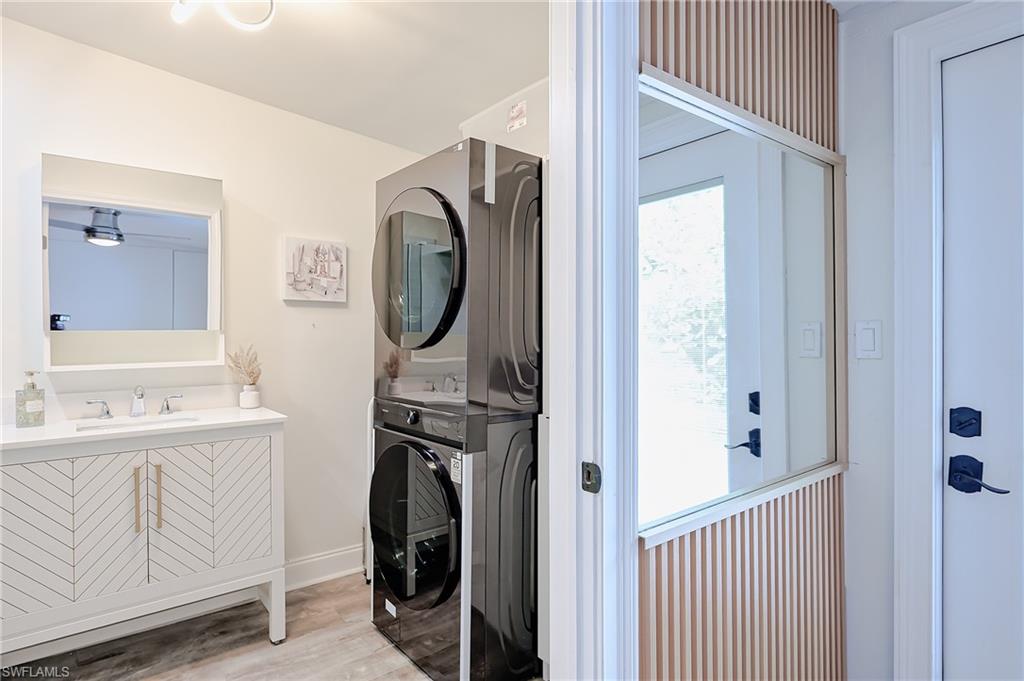 757 101st Avenue North Naples, FL 34108 - Photo 15 of 33 a view of bathroom with a sink and washing machine