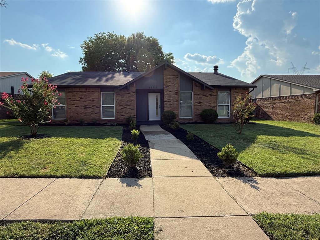 6405 Tyler Court Plano, TX 75023 - Photo 1 of 1 a front view of a house with a garden
