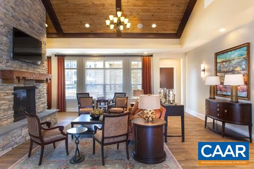 2015 Reserve Circle, Unit 14 Harrisonburg, VA 22801 - Photo 14 of 19 a living room with furniture a flat screen tv and a fireplace