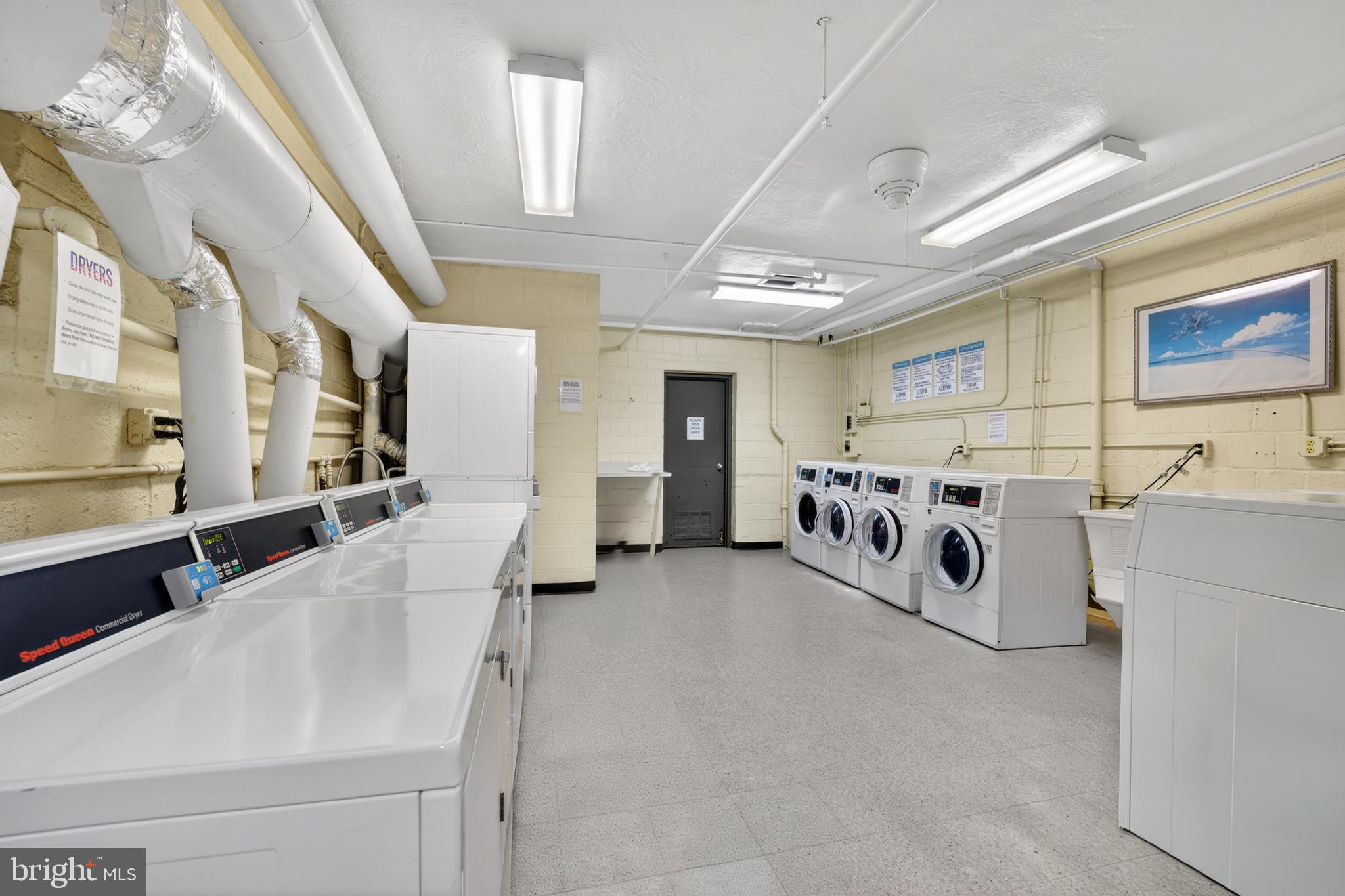 2325 42nd Street Northwest, Unit 104 Washington, DC 20007 - Photo 18 of 25 a utility room with dryer and washer