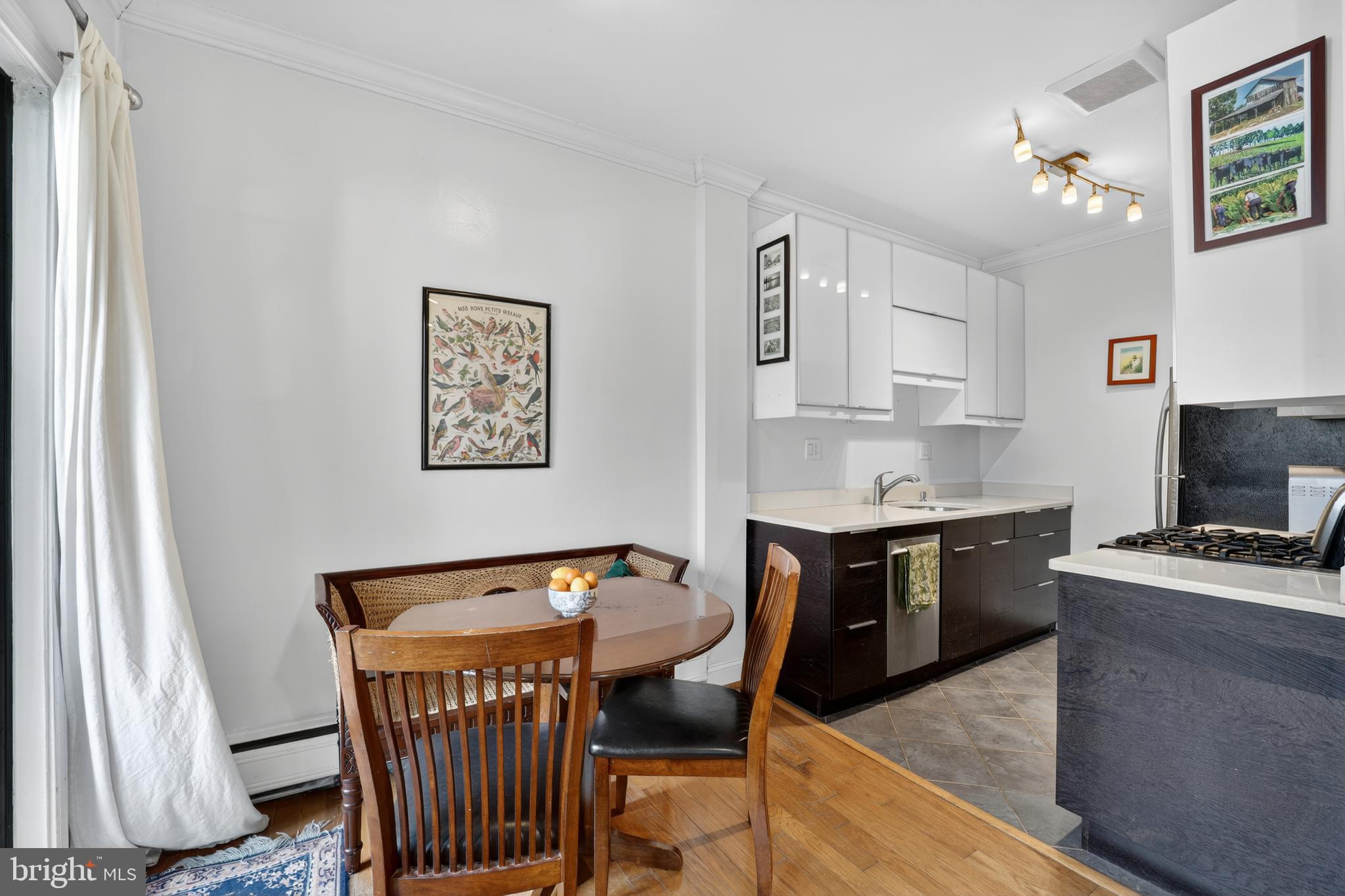 2325 42nd Street Northwest, Unit 104 Washington, DC 20007 - Photo 4 of 25 a view of a workspace with furniture and wooden floor
