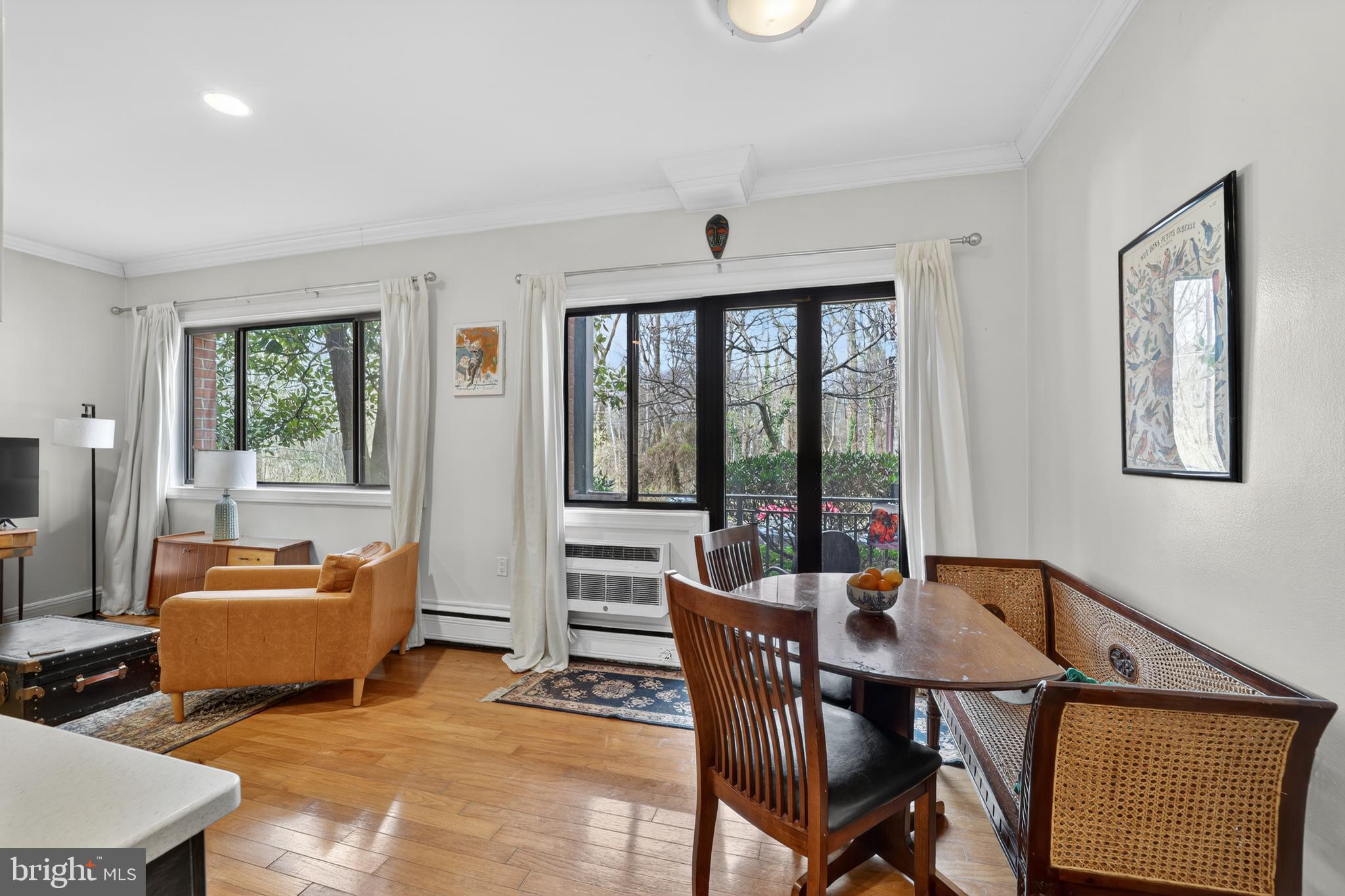 2325 42nd Street Northwest, Unit 104 Washington, DC 20007 - Photo 9 of 25 a dining room with furniture and a window