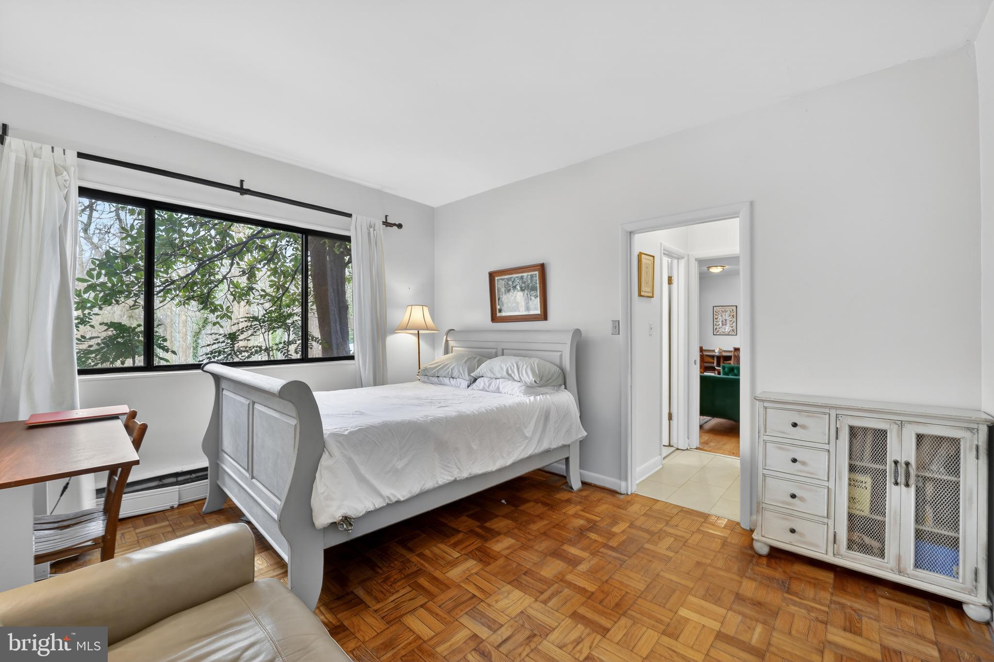2325 42nd Street Northwest, Unit 104 Washington, DC 20007 - Photo 10 of 25 a bedroom with a bed and a couch