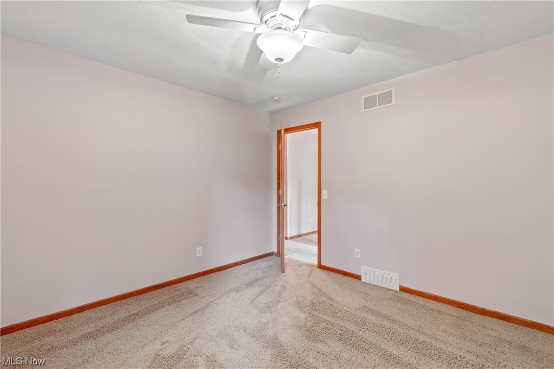 1819 Beryl Road Akron, OH 44312 - Photo 23 of 35 Unfurnished room featuring light carpet and ceiling fan