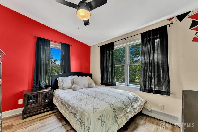 a bedroom with a large bed and a window