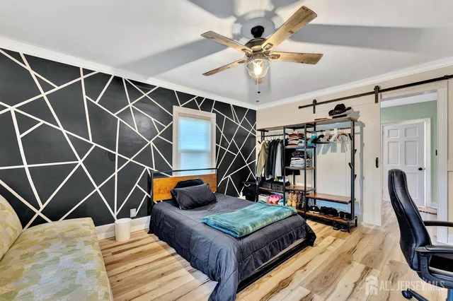 a bedroom with furniture and a gym equipment