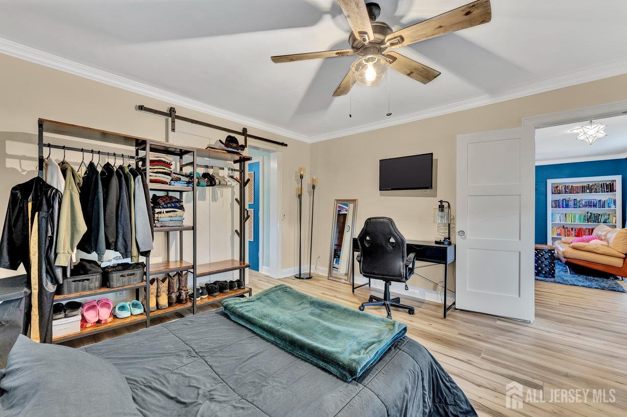 254 Friendship Road Monmouth Junction, NJ 08852 - Photo 21 of 33 a living room with lots of furniture and gym equipment