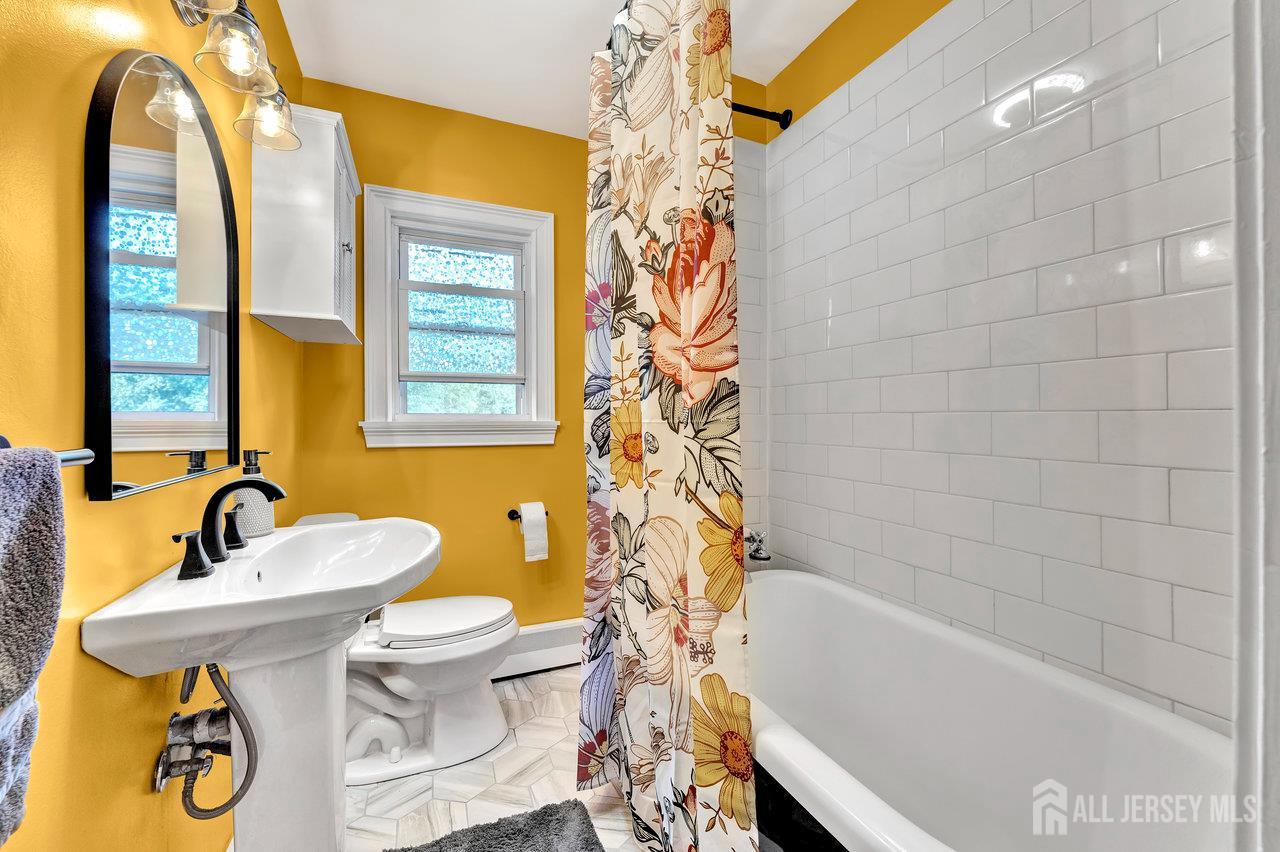 254 Friendship Road Monmouth Junction, NJ 08852 - Photo 24 of 33 a bathroom with a sink and a bathtub
