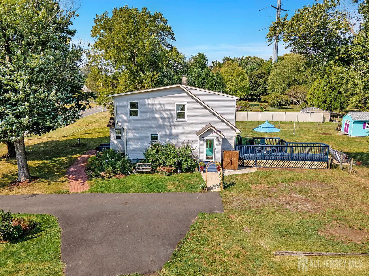 254 Friendship Road Monmouth Junction, NJ 08852 - Photo 25 of 33 a front view of a house with a yard and trees