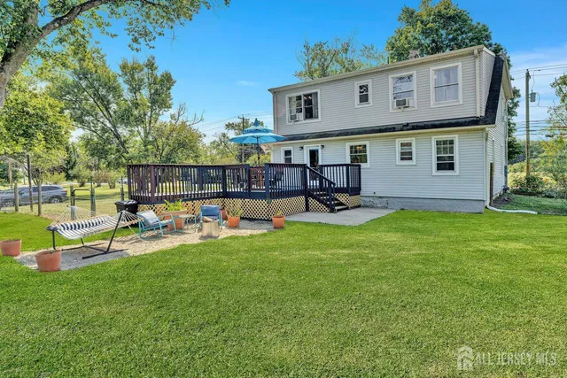a view of a house with a yard porch and sitting area