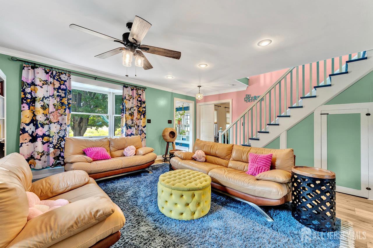 254 Friendship Road Monmouth Junction, NJ 08852 - Photo 7 of 33 a living room with furniture and a chandelier