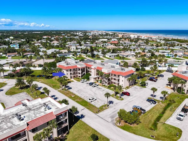 a view of a balcony with wooden floor