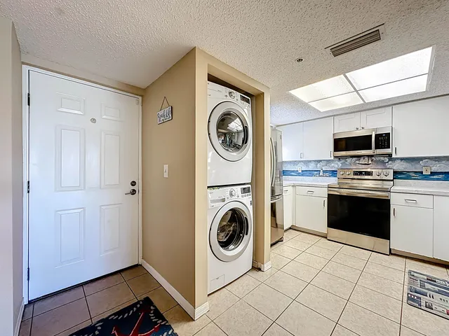 a kitchen with a stove and a microwave