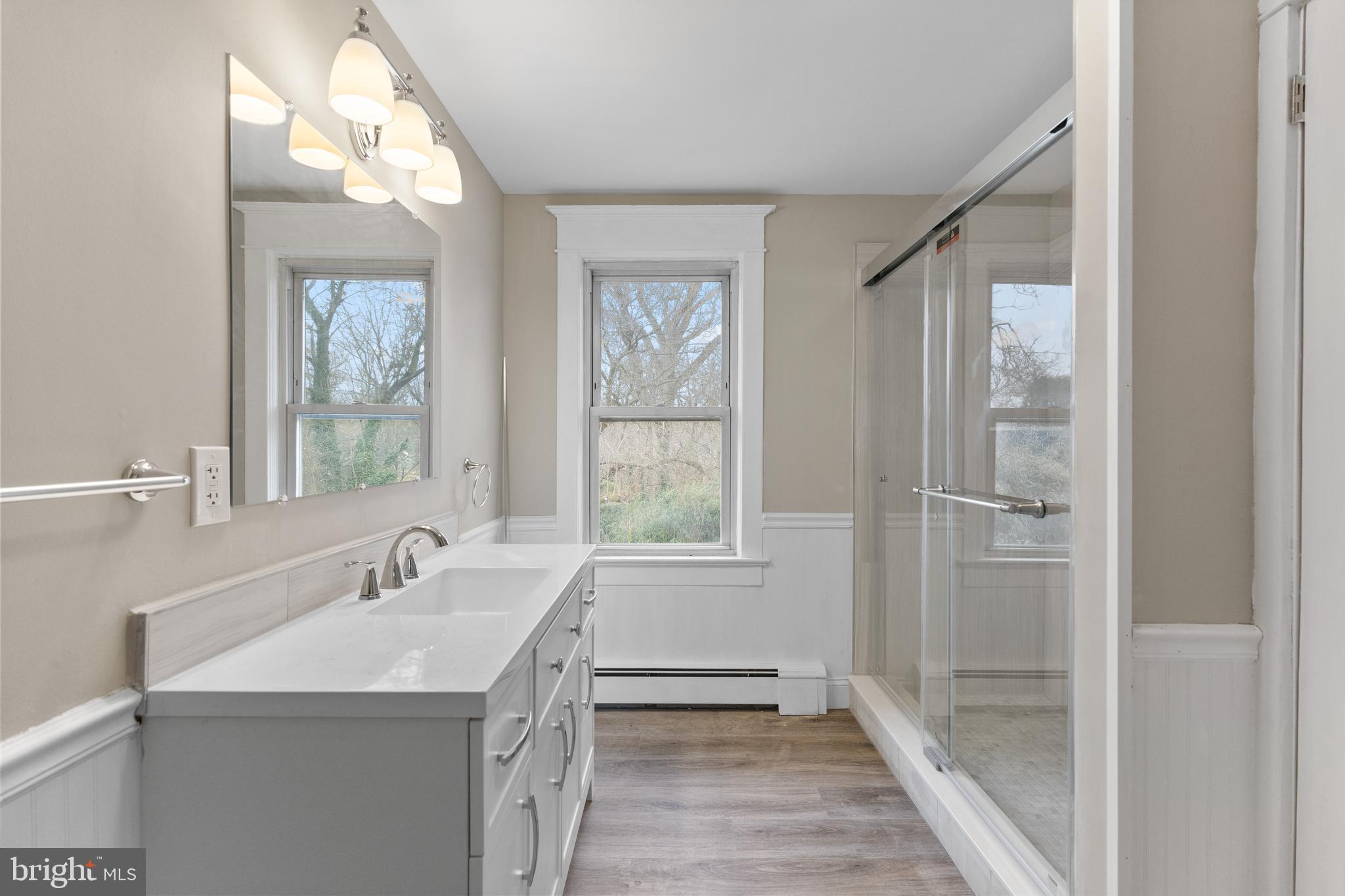818 Stiles Avenue Maple Shade, NJ 08052 - Photo 11 of 11 a bathroom with a sink a mirror and a bathtub
