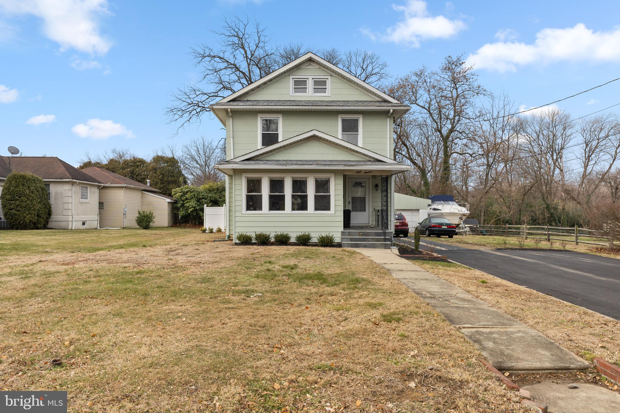 818 Stiles Avenue Maple Shade, NJ 08052 - Photo 2 of 11 a front view of a house with a yard