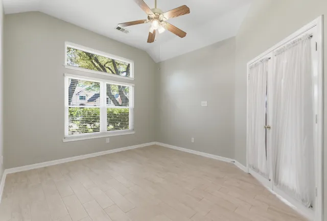 a view of an empty room with a window