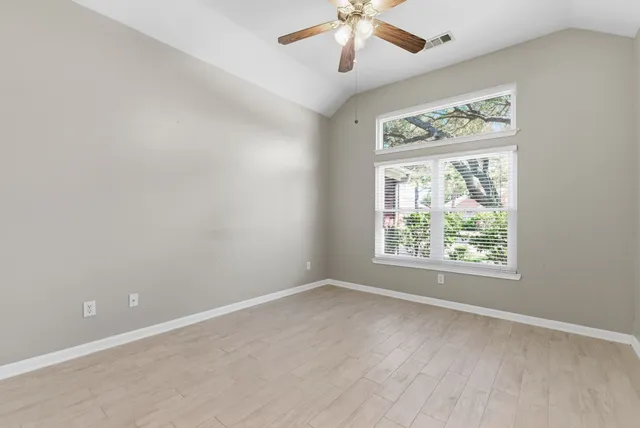 a view of an empty room with a window