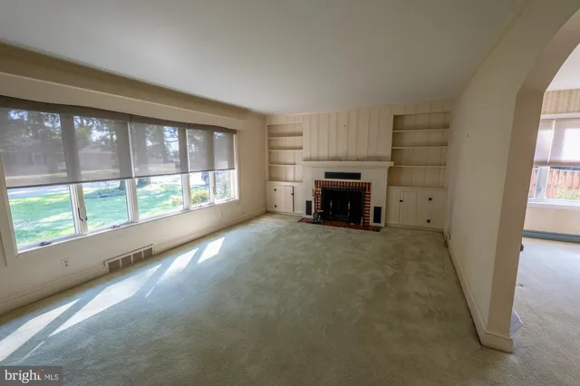a view of hallway with wooden floor