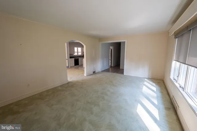 a bathroom with a sink and mirror with shower