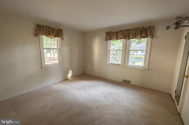 an empty room with windows