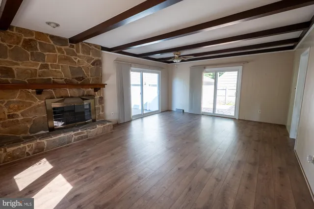 a kitchen with a stove a sink and a refrigerator