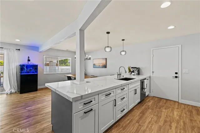 a spacious bathroom with double vanity and a mirror