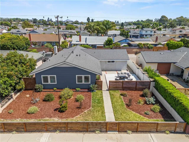 an aerial view of a house with yard swimming pool and outdoor seating