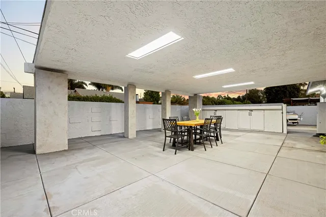 a dining room with furniture and a garden