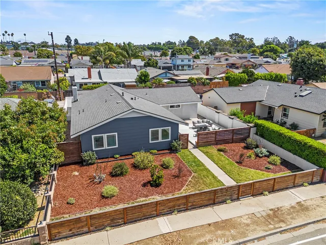 an aerial view of a house with outdoor space and lake view
