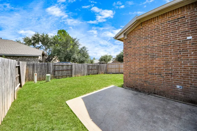 an aerial view of a house with yard swimming pool and outdoor seating
