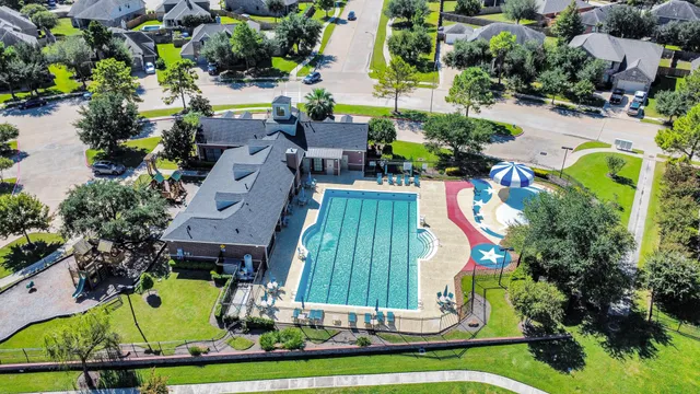 an aerial view of a house with a swimming pool