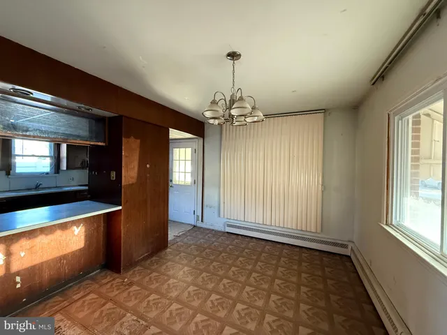 a view of a room with window and wooden floor