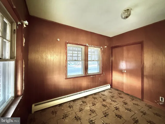 a view of an empty room and window