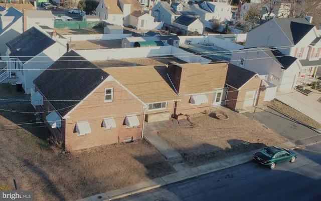 an aerial view of a house with swimming pool