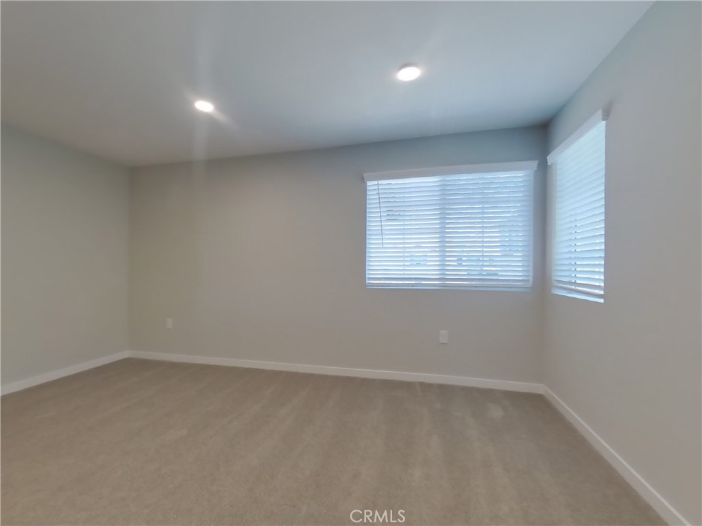 28201 Cookhouse Lane Menifee, CA 92584 - Photo 14 of 32 an empty room with a window
