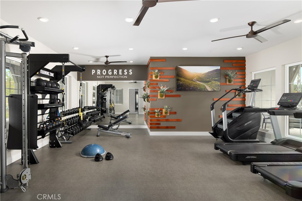 28201 Cookhouse Lane Menifee, CA 92584 - Photo 17 of 32 a view of a room with gym equipment