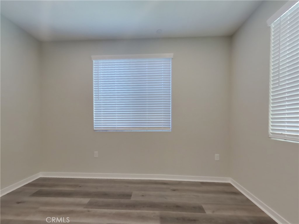 28201 Cookhouse Lane Menifee, CA 92584 - Photo 2 of 32 an empty room with a window