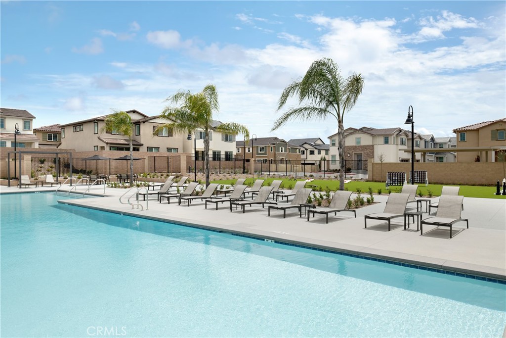28201 Cookhouse Lane Menifee, CA 92584 - Photo 22 of 32 a view of swimming pool with outdoor seating and plants