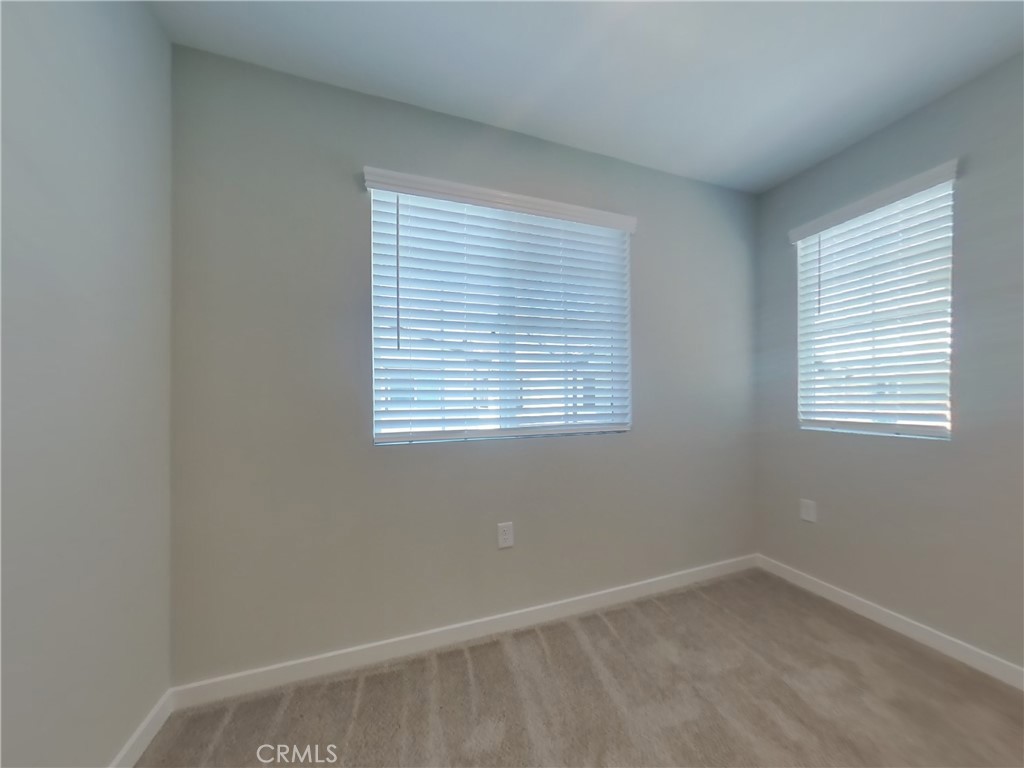 28201 Cookhouse Lane Menifee, CA 92584 - Photo 10 of 32 an empty room with a window