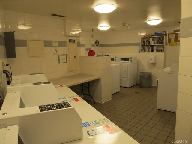 a room with a washing machine and sink