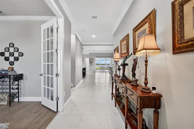 a kitchen with stainless steel appliances kitchen island granite countertop a stove a sink and a microwave