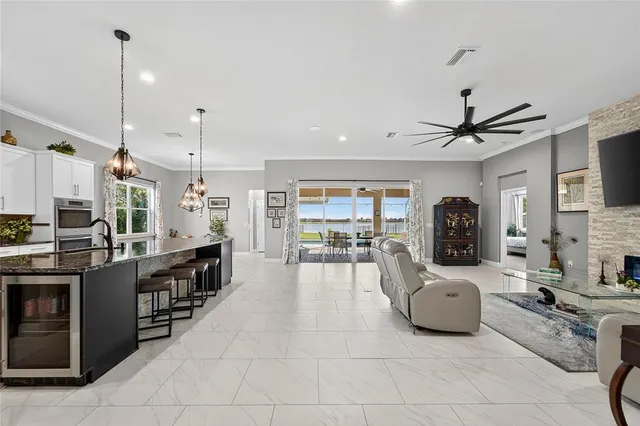 a kitchen with stainless steel appliances granite countertop a sink stove and cabinets