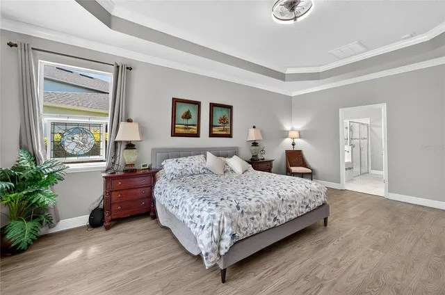 a living room with furniture and a ceiling fan