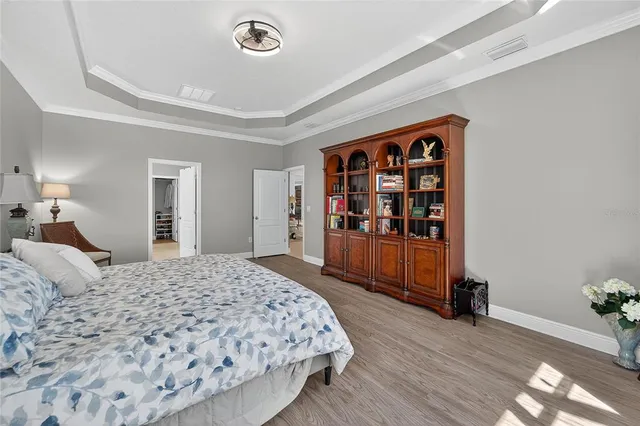 a bathroom with a double vanity sink a mirror and a bathtub